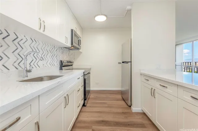 a kitchen with a sink and cabinets