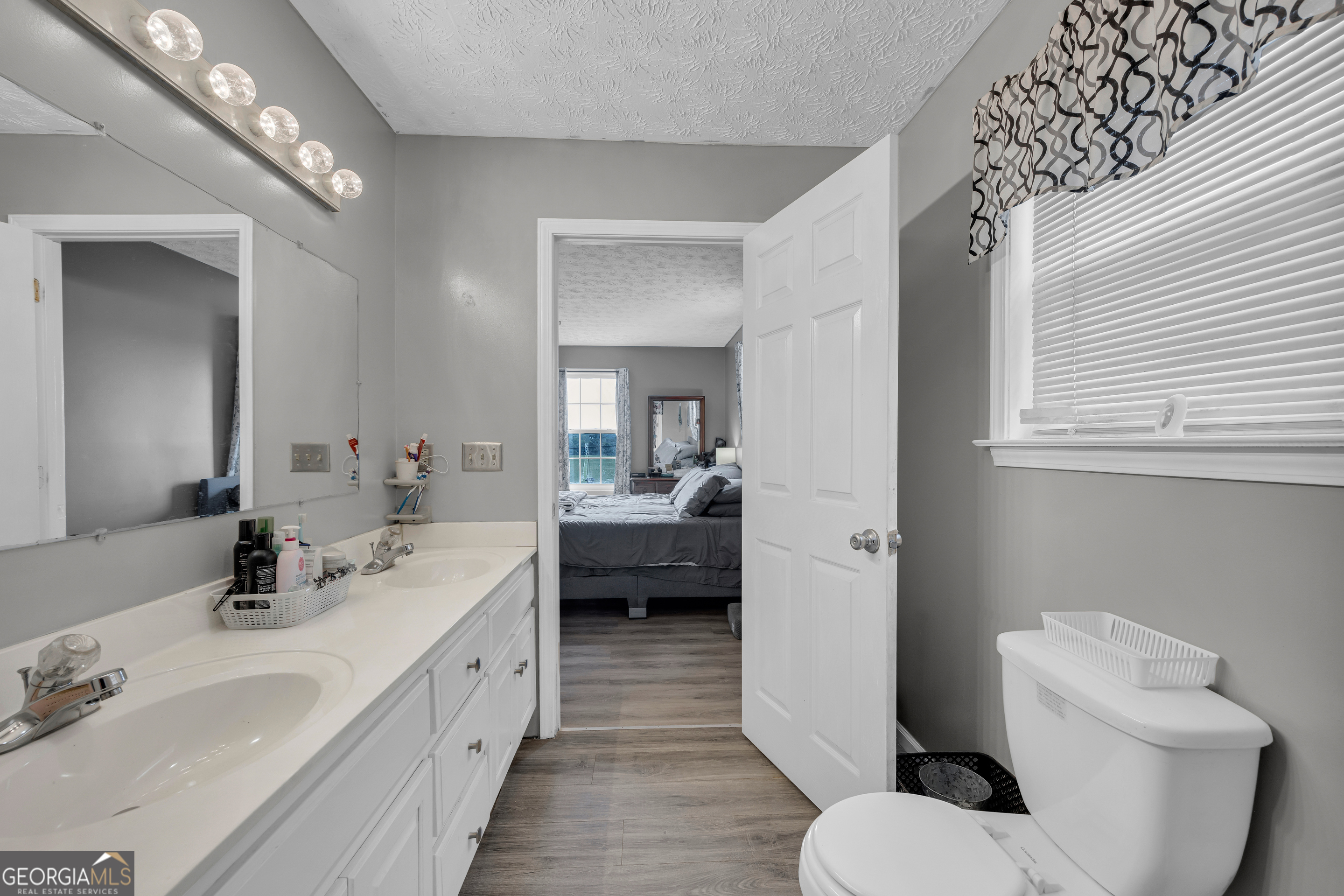 156 Shirley Road Royston, GA 30662 - Photo 15 of 29 a bathroom with a toilet a sink and mirror