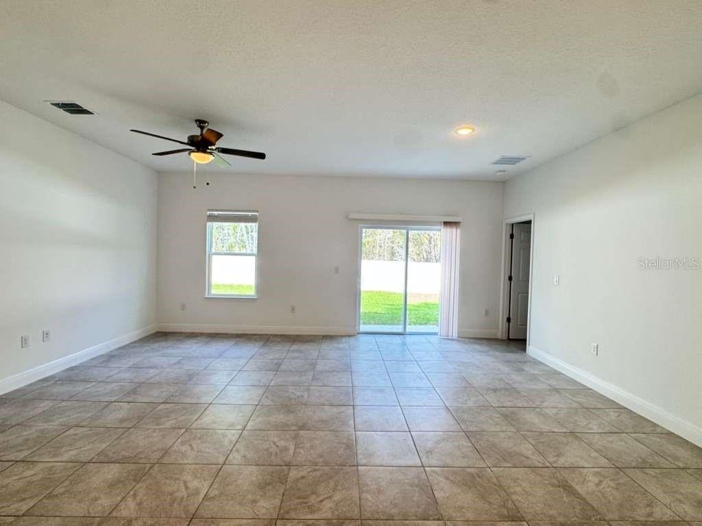 16054 Southwest 55th Avenue Road Ocala, FL 34473 - Photo 17 of 58 a view of an empty room with a window