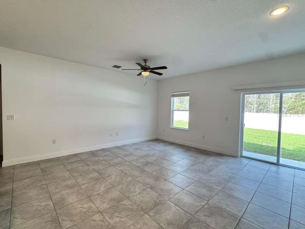 16054 Southwest 55th Avenue Road Ocala, FL 34473 - Photo 18 of 58 a view of an empty room with a window
