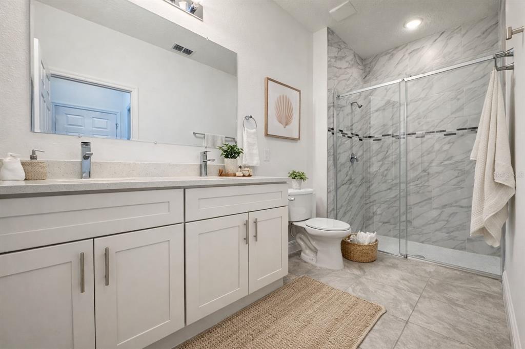 16054 Southwest 55th Avenue Road Ocala, FL 34473 - Photo 24 of 58 a bathroom with a sink toilet and shower