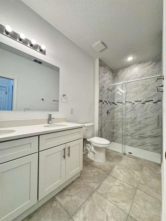 16054 Southwest 55th Avenue Road Ocala, FL 34473 - Photo 27 of 58 a bathroom with a toilet sink and a mirror
