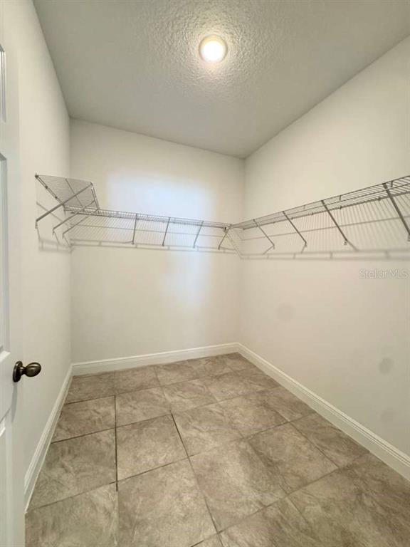 16054 Southwest 55th Avenue Road Ocala, FL 34473 - Photo 30 of 58 a view of a room with racks on the wall