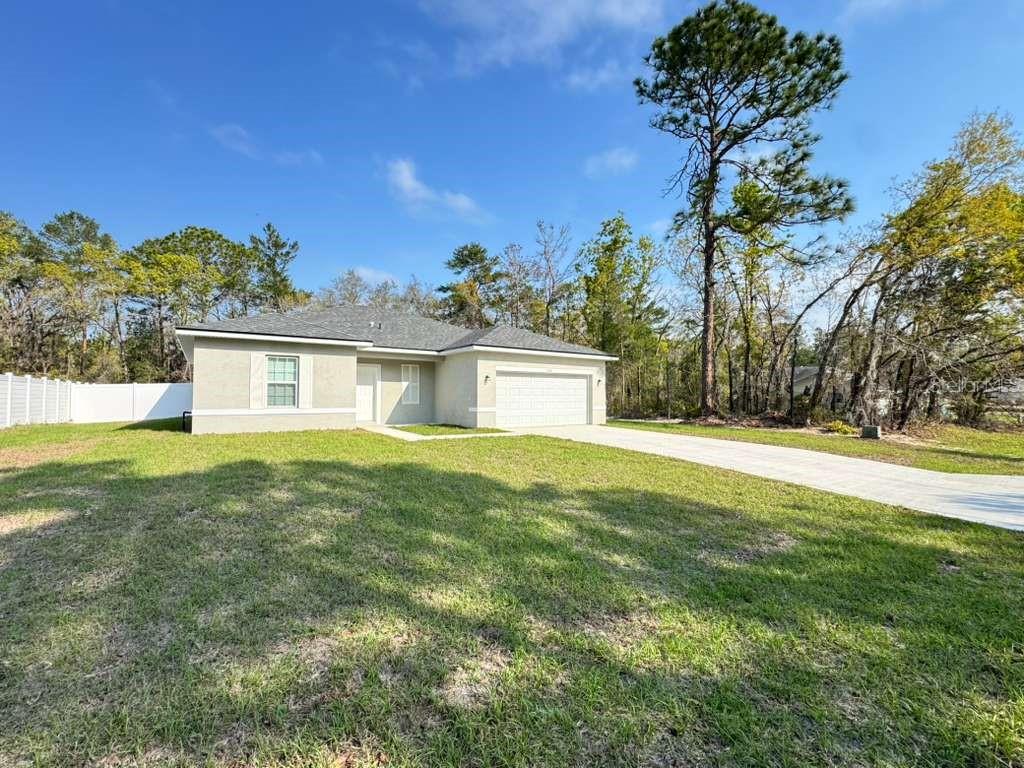 16054 Southwest 55th Avenue Road Ocala, FL 34473 - Photo 3 of 58 a house view with a outdoor space