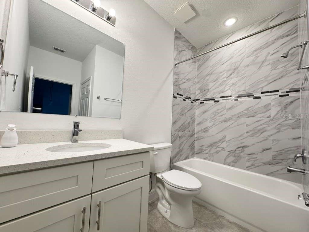 16054 Southwest 55th Avenue Road Ocala, FL 34473 - Photo 43 of 58 a bathroom with a sink a toilet and a bathtub