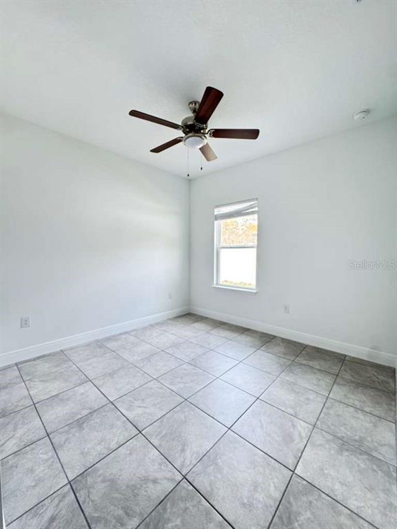 16054 Southwest 55th Avenue Road Ocala, FL 34473 - Photo 44 of 58 a view of an empty room with a window
