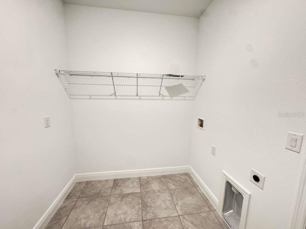16054 Southwest 55th Avenue Road Ocala, FL 34473 - Photo 48 of 58 a view of a room with racks on the wall