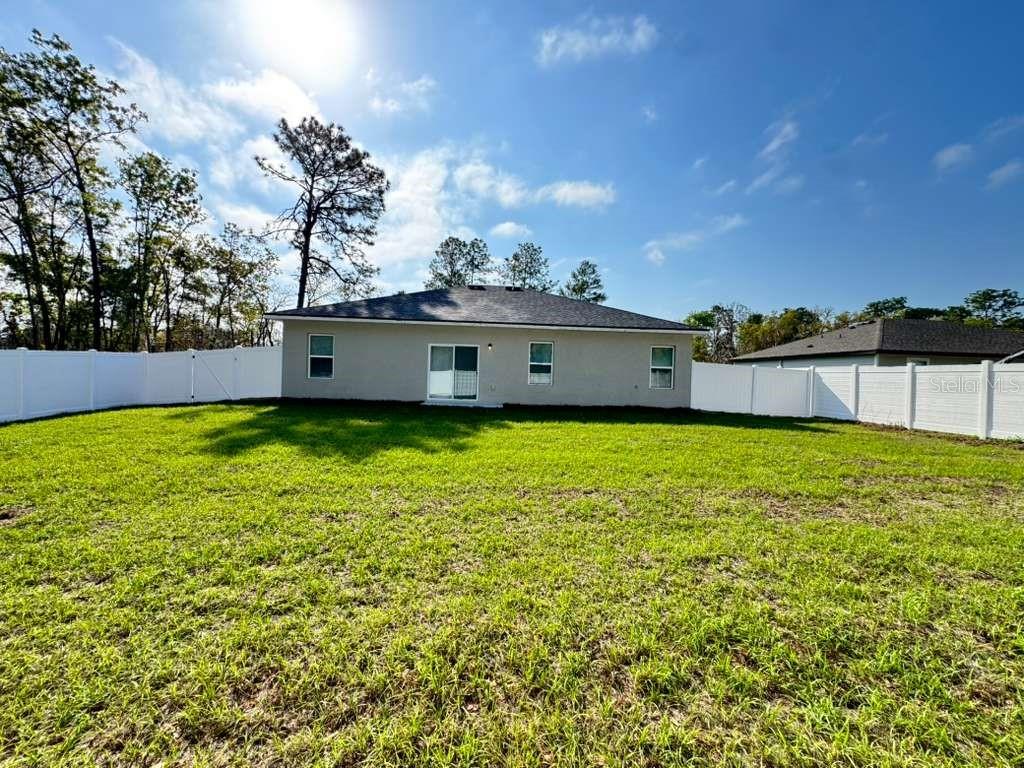 16054 Southwest 55th Avenue Road Ocala, FL 34473 - Photo 52 of 58 a view of a lake with a big yard