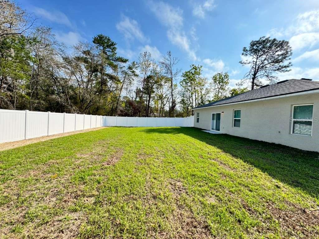 16054 Southwest 55th Avenue Road Ocala, FL 34473 - Photo 55 of 58 a view of a back yard