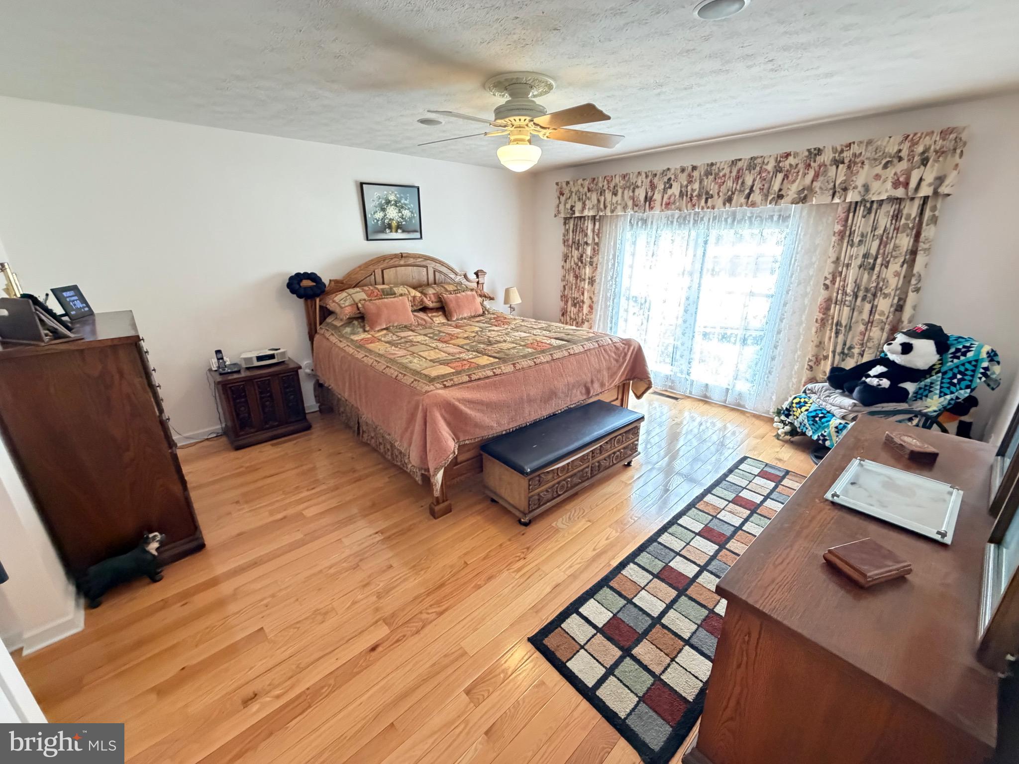 1565 Liberty Street Keyser, WV 26726 - Photo 18 of 95 a bedroom with a bed window and a table in it