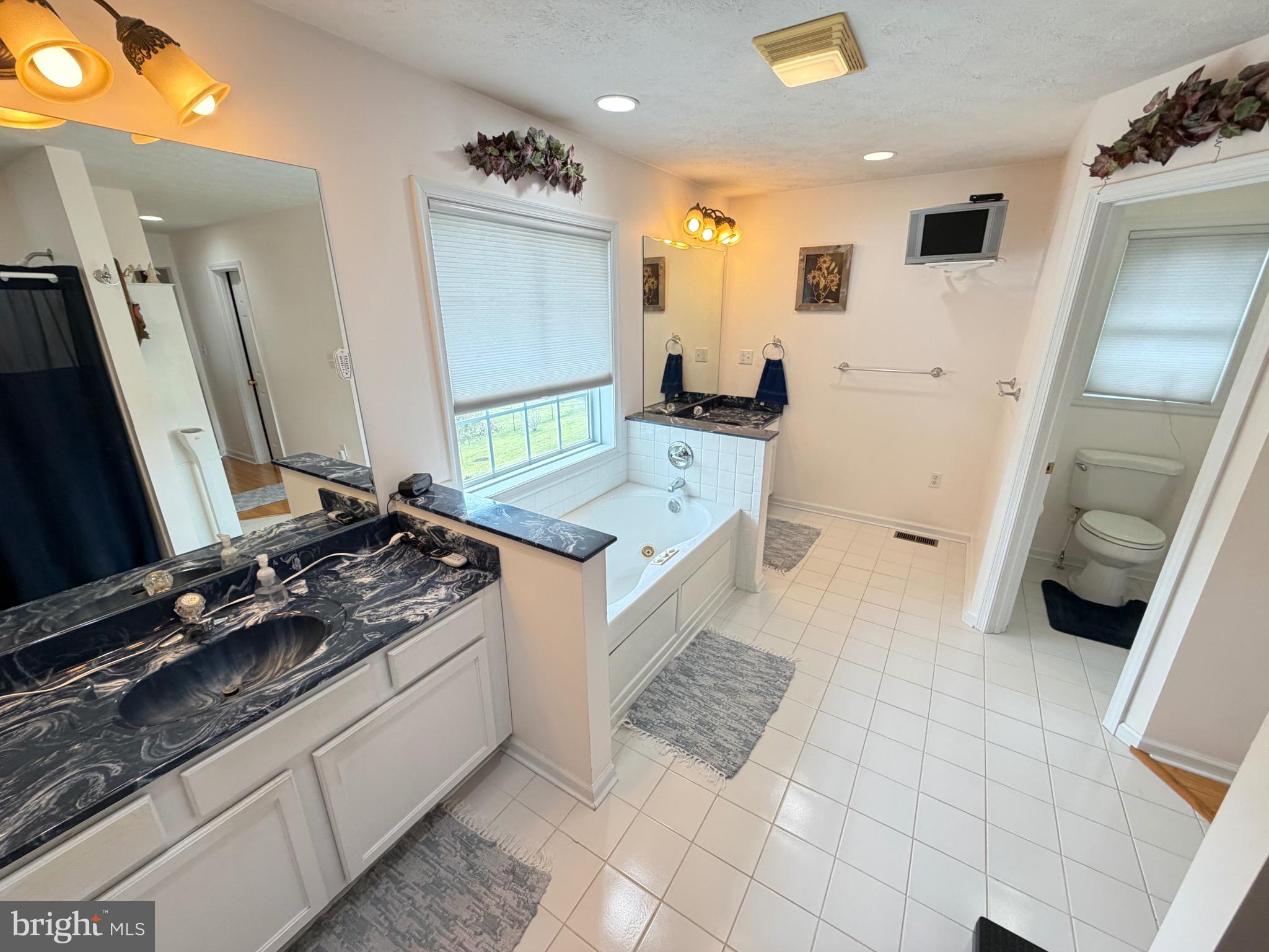 1565 Liberty Street Keyser, WV 26726 - Photo 25 of 95 a kitchen with a sink stove and cabinets