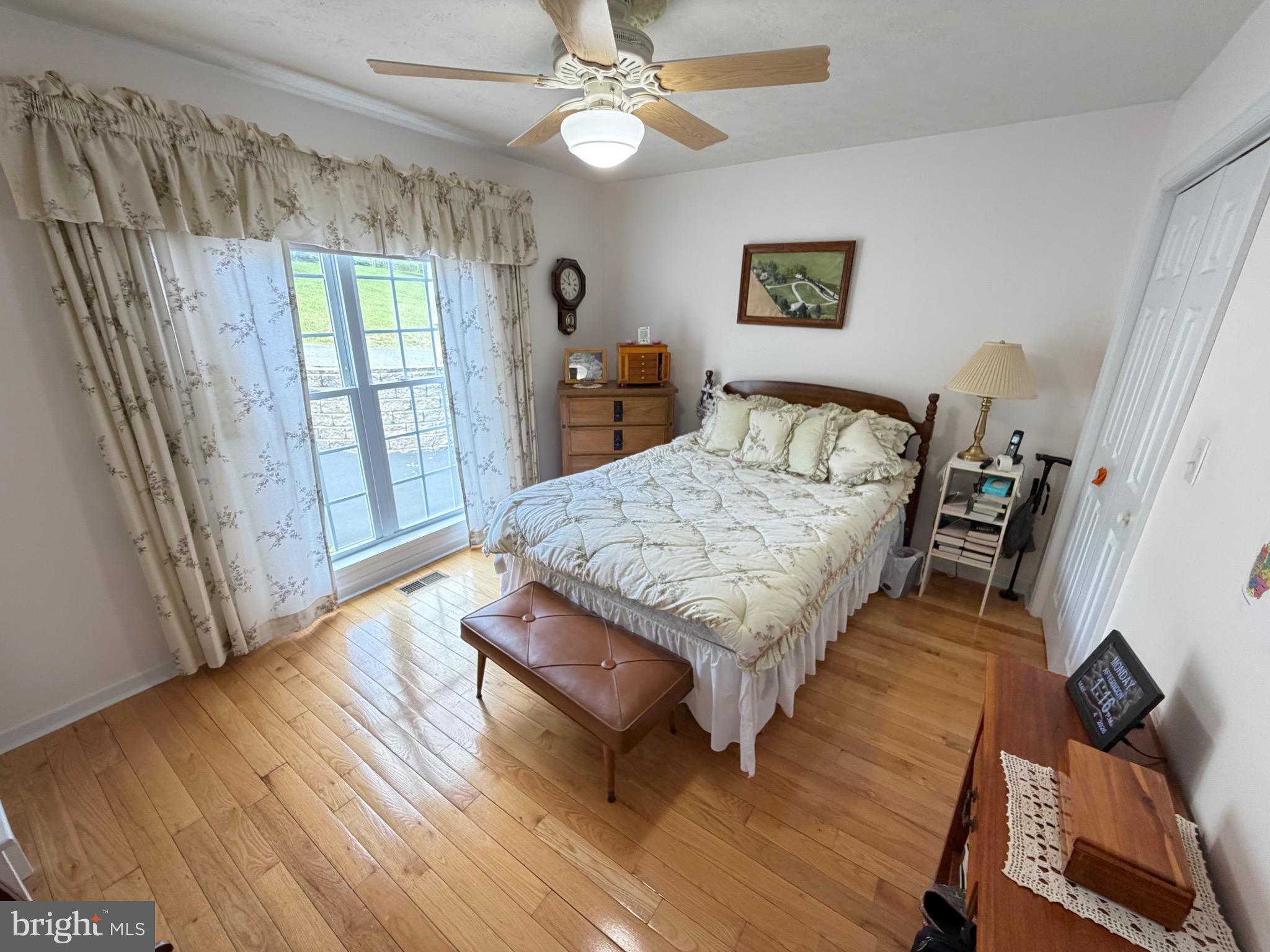 1565 Liberty Street Keyser, WV 26726 - Photo 26 of 95 a living room with furniture and a wooden floor