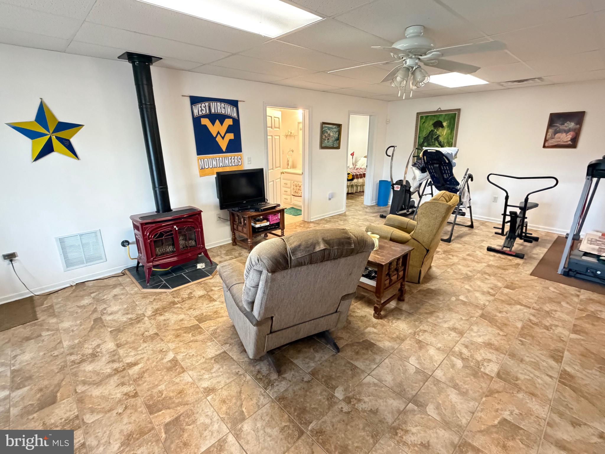 1565 Liberty Street Keyser, WV 26726 - Photo 38 of 95 a living room with furniture and a flat screen tv