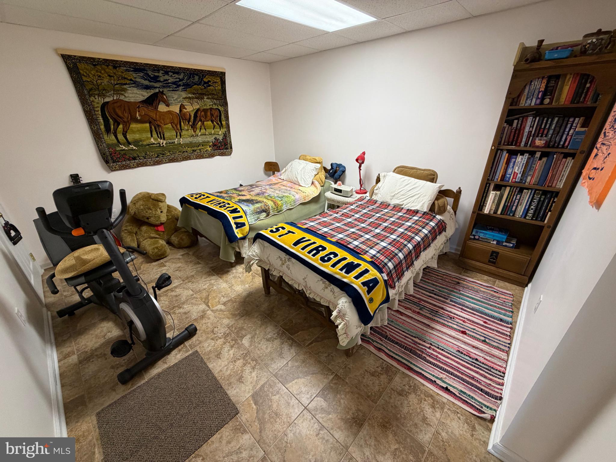 1565 Liberty Street Keyser, WV 26726 - Photo 39 of 95 a bedroom with furniture and a book shelf