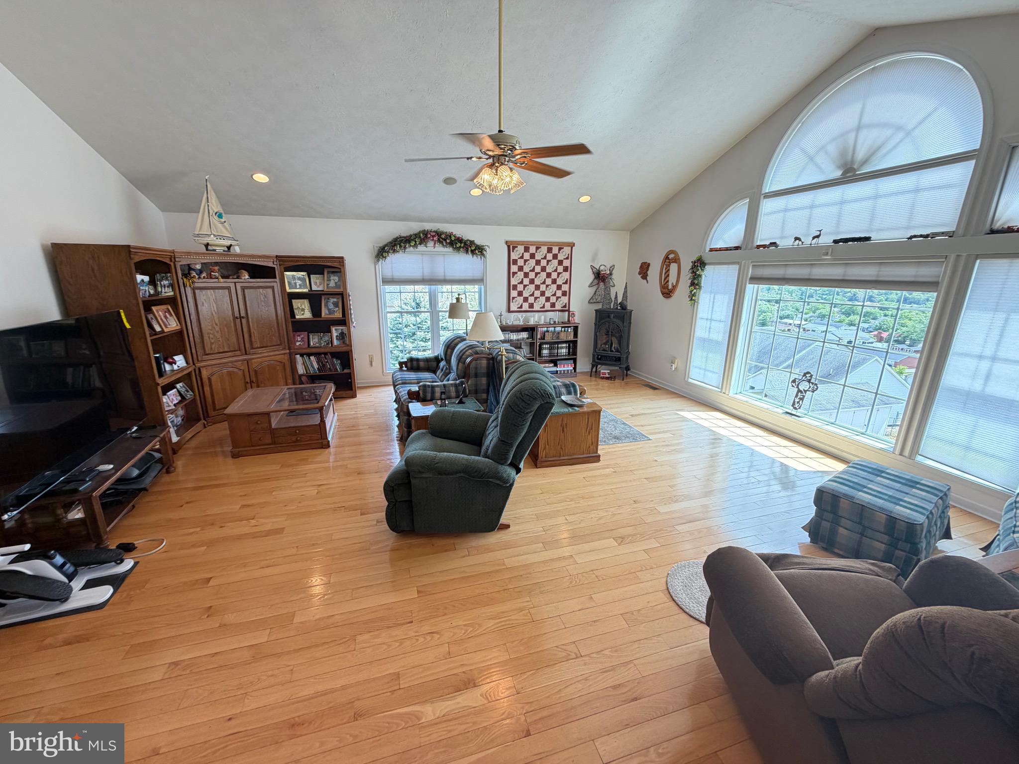 1565 Liberty Street Keyser, WV 26726 - Photo 4 of 95 a living room with furniture a flat screen tv and a large window