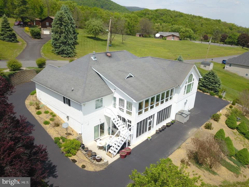 1565 Liberty Street Keyser, WV 26726 - Photo 54 of 95 an aerial view of a house with a yard basket ball court and outdoor seating