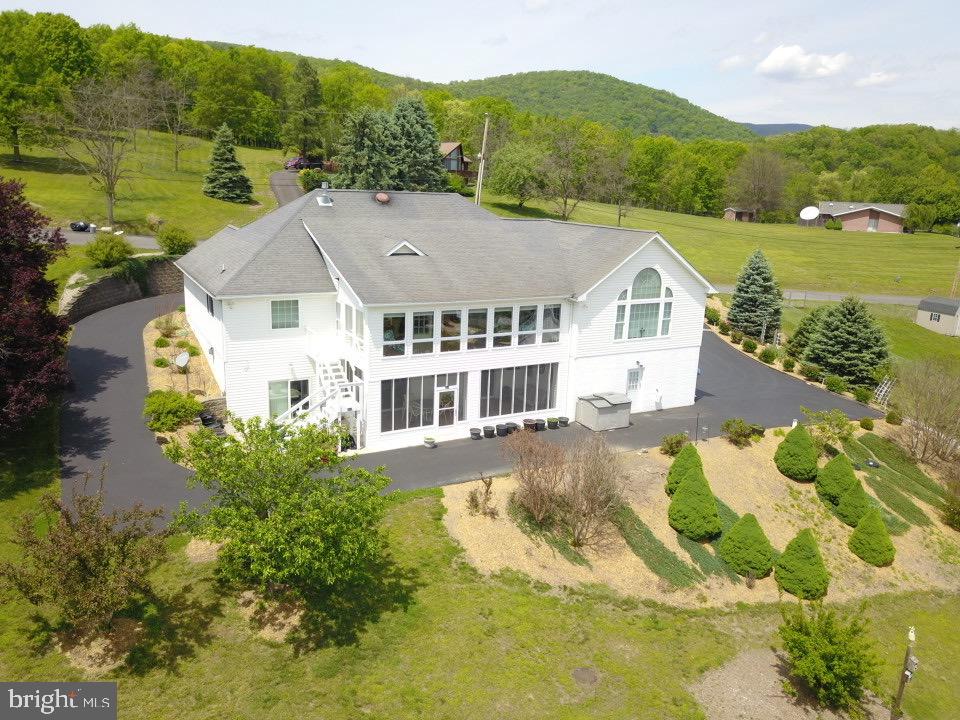 1565 Liberty Street Keyser, WV 26726 - Photo 58 of 95 a view of a big house with a big yard and large trees