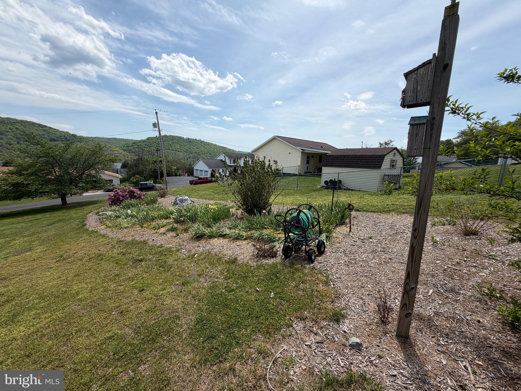1565 Liberty Street Keyser, WV 26726 - Photo 93 of 95 a view of a garden with a table and chairs