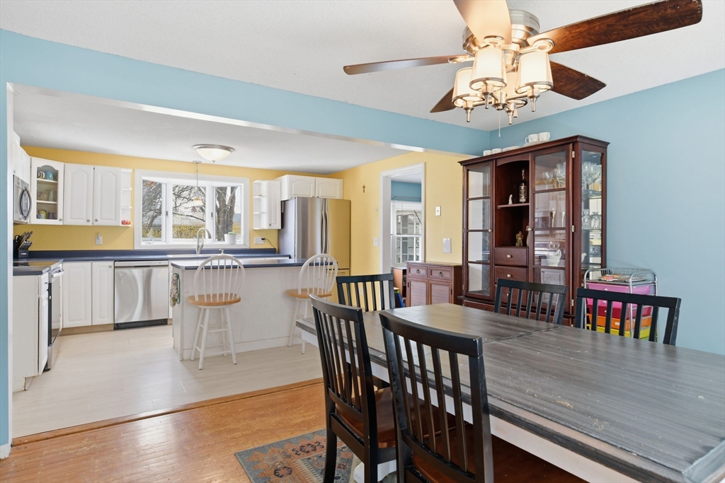 244 Lower Westfield Road Holyoke, MA 01040 - Photo 16 of 39 a view of a dining room with furniture window and wooden floor