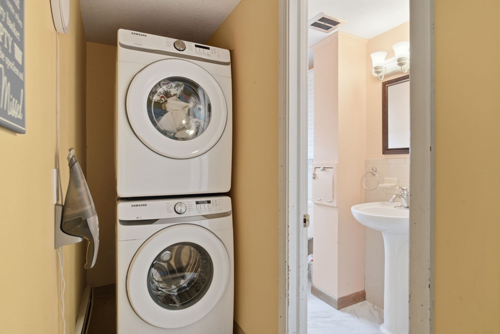 244 Lower Westfield Road Holyoke, MA 01040 - Photo 23 of 39 a utility room with dryer and washer