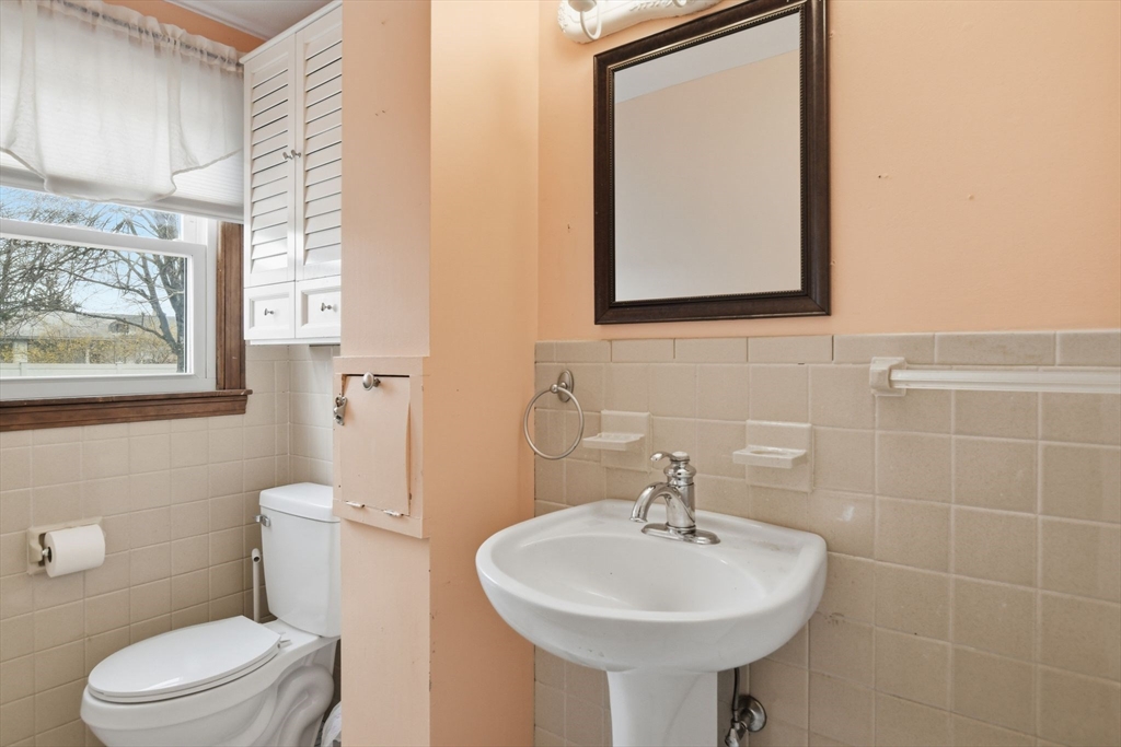244 Lower Westfield Road Holyoke, MA 01040 - Photo 24 of 39 a bathroom with a sink toilet and mirror