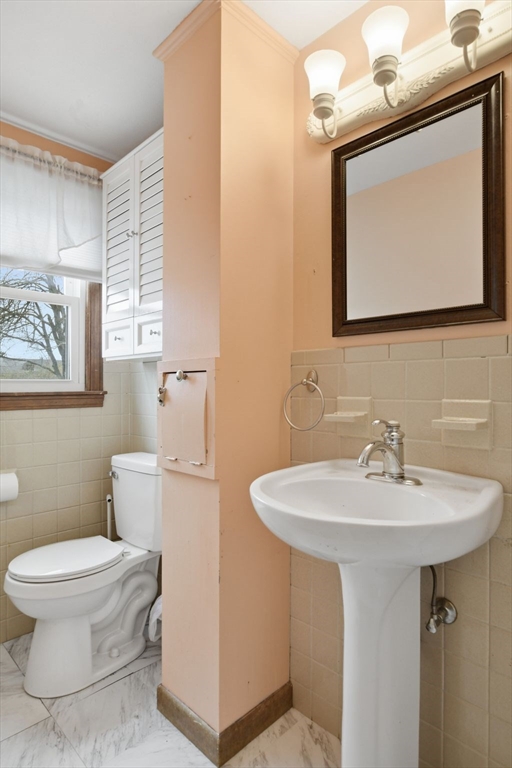 244 Lower Westfield Road Holyoke, MA 01040 - Photo 25 of 39 a bathroom with a toilet sink and mirror