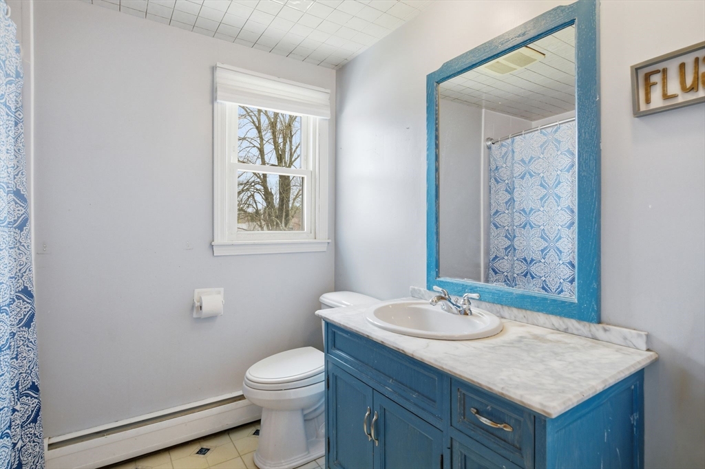 244 Lower Westfield Road Holyoke, MA 01040 - Photo 30 of 39 a bathroom with a granite countertop sink toilet and a mirror