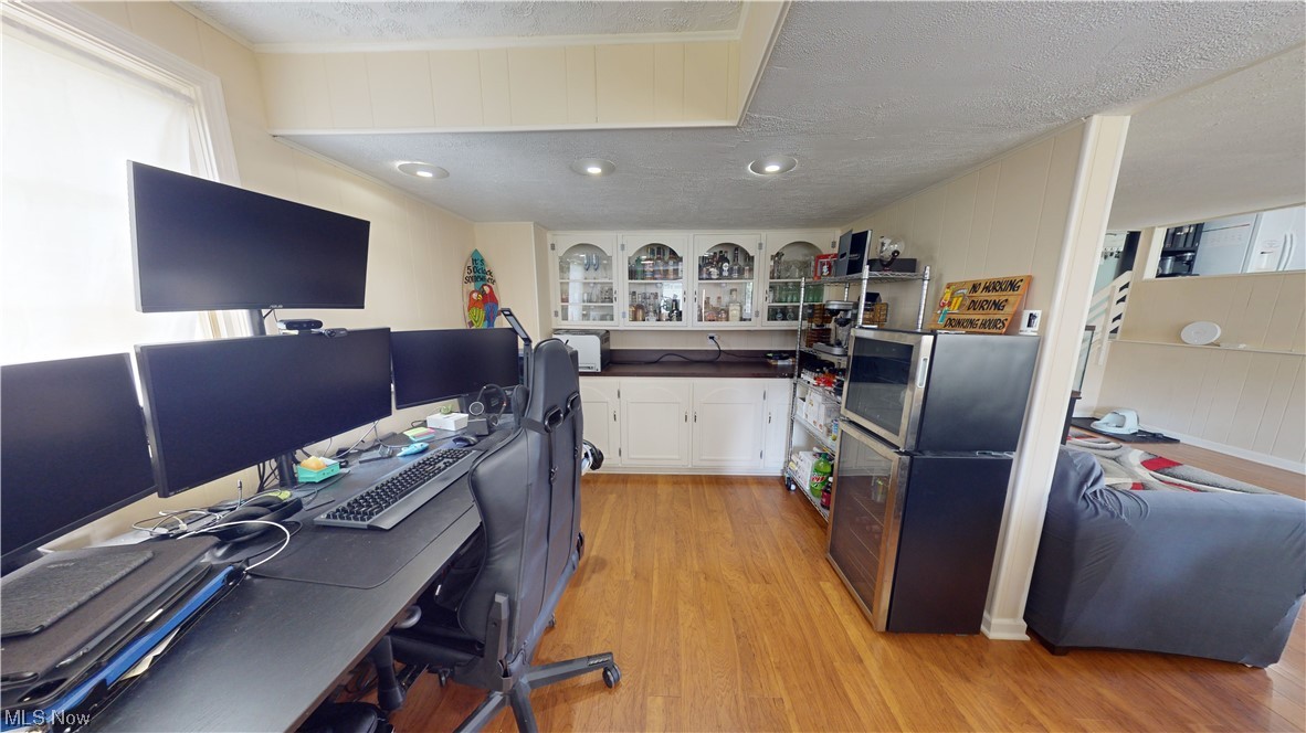 1071 Roland Road Lyndhurst, OH 44124 - Photo 16 of 30 Hardwood floored office with a textured ceiling