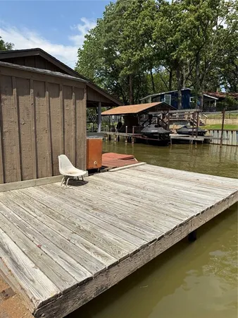 a view of staircase with wooden floor and white walls