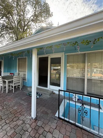 a view of back yard of a house