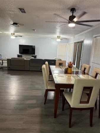 a living room with furniture and fireplace
