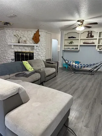 a kitchen with a stove a refrigerator and a more cabinets