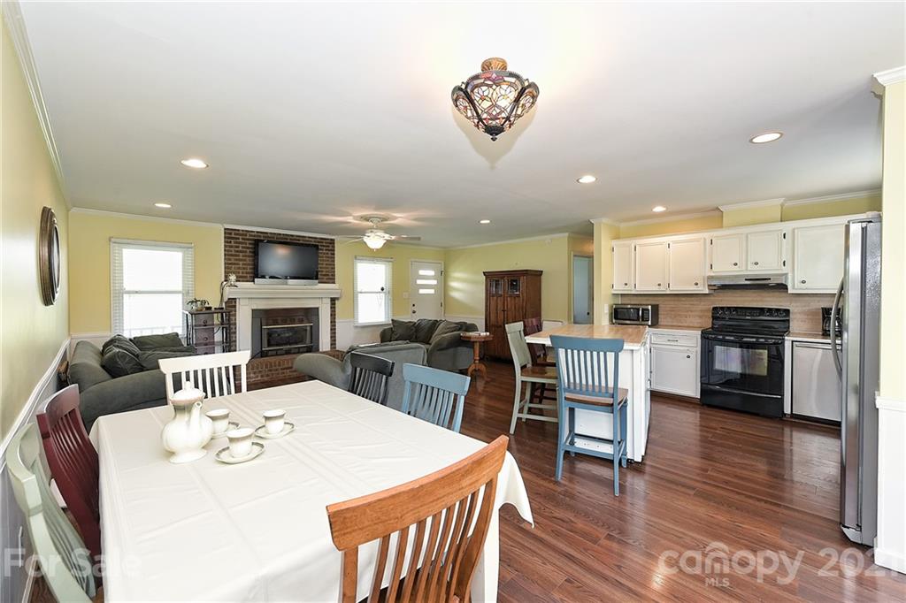 1721 Rock Rest Road Wingate, NC 28174 - Photo 16 of 47 a large kitchen with a table and chairs
