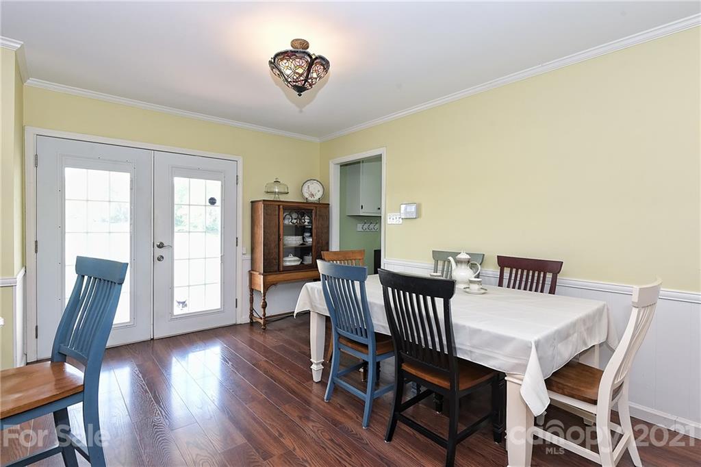 1721 Rock Rest Road Wingate, NC 28174 - Photo 17 of 47 a view of a dining room with furniture and wooden floor