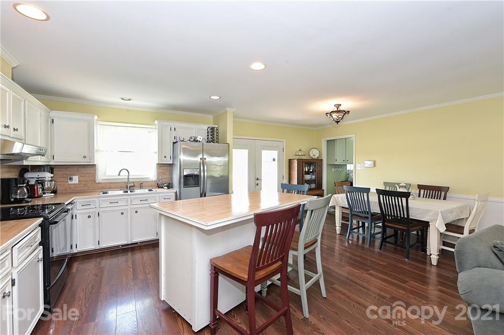 1721 Rock Rest Road Wingate, NC 28174 - Photo 19 of 47 a large kitchen with a table and chairs