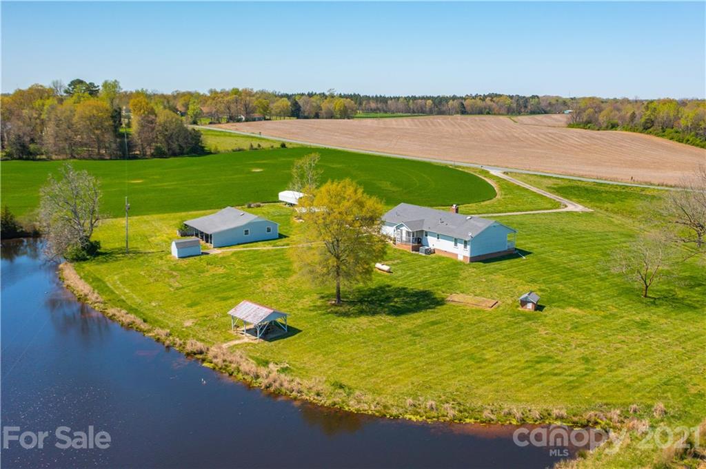 1721 Rock Rest Road Wingate, NC 28174 - Photo 4 of 47 a view of a lake with a big yard