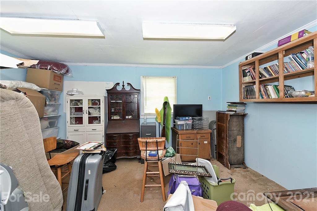 1721 Rock Rest Road Wingate, NC 28174 - Photo 33 of 47 a living room with furniture a window and a flat screen tv