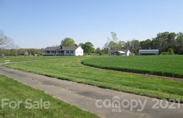 1721 Rock Rest Road Wingate, NC 28174 - Photo 5 of 47 a view of a golf course with a garden