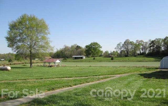 1721 Rock Rest Road Wingate, NC 28174 - Photo 6 of 47 a view of grassy field with trees