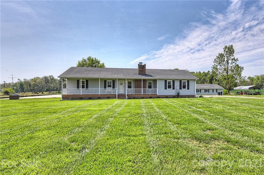 1721 Rock Rest Road Wingate, NC 28174 - Photo 8 of 47 a view of a house with a yard