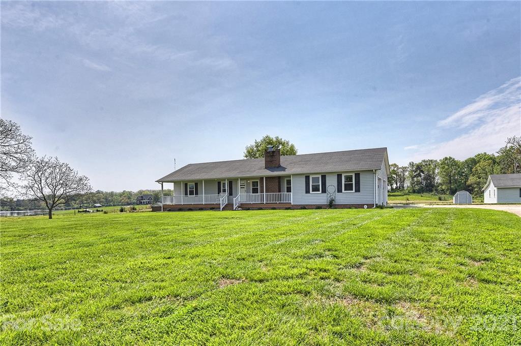 1721 Rock Rest Road Wingate, NC 28174 - Photo 9 of 47 a front view of a house with garden