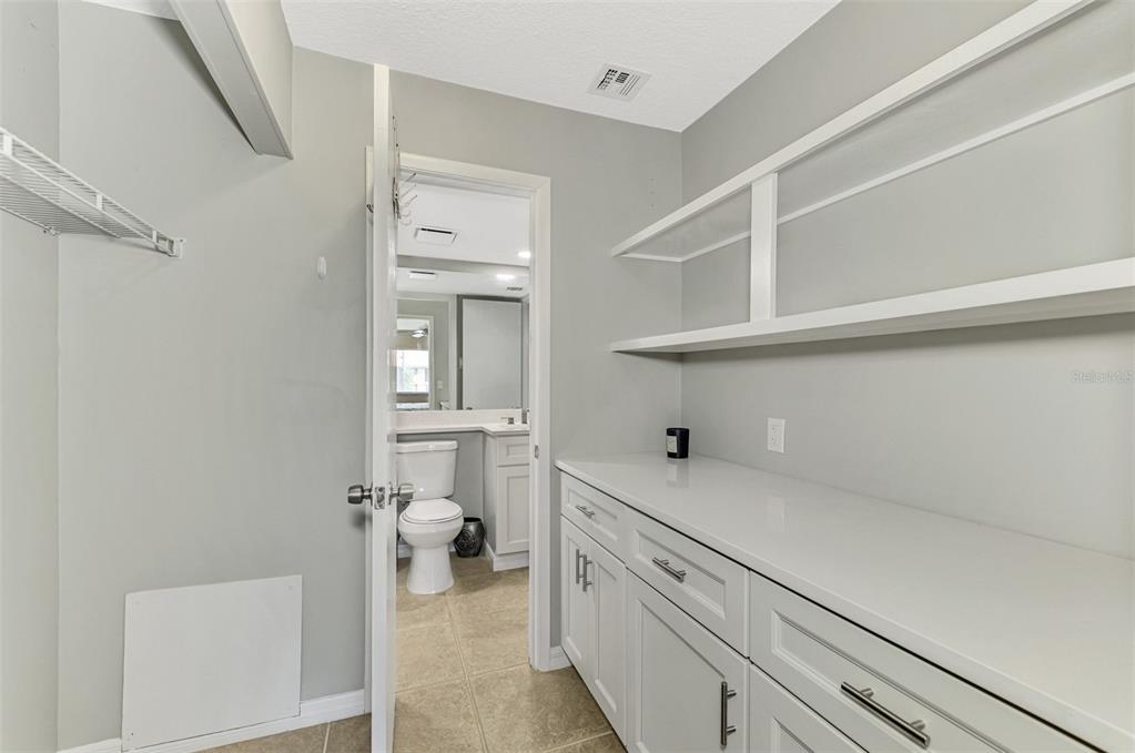 1618 Stickney Point Road, Unit 1618202 Sarasota, FL 34231 - Photo 32 of 58 a kitchen with a cabinets and a stove