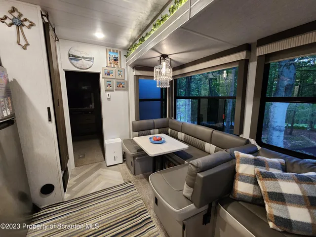 a kitchen with stainless steel appliances granite countertop a refrigerator and a stove