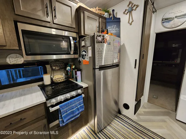 a kitchen with a stove and a microwave