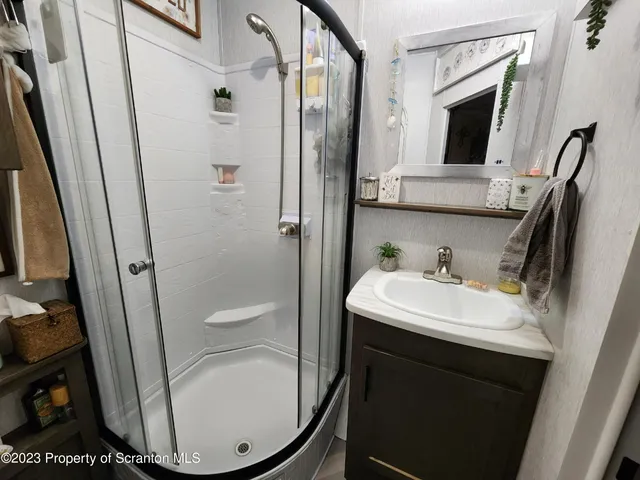 a bedroom with furniture and a flat screen tv