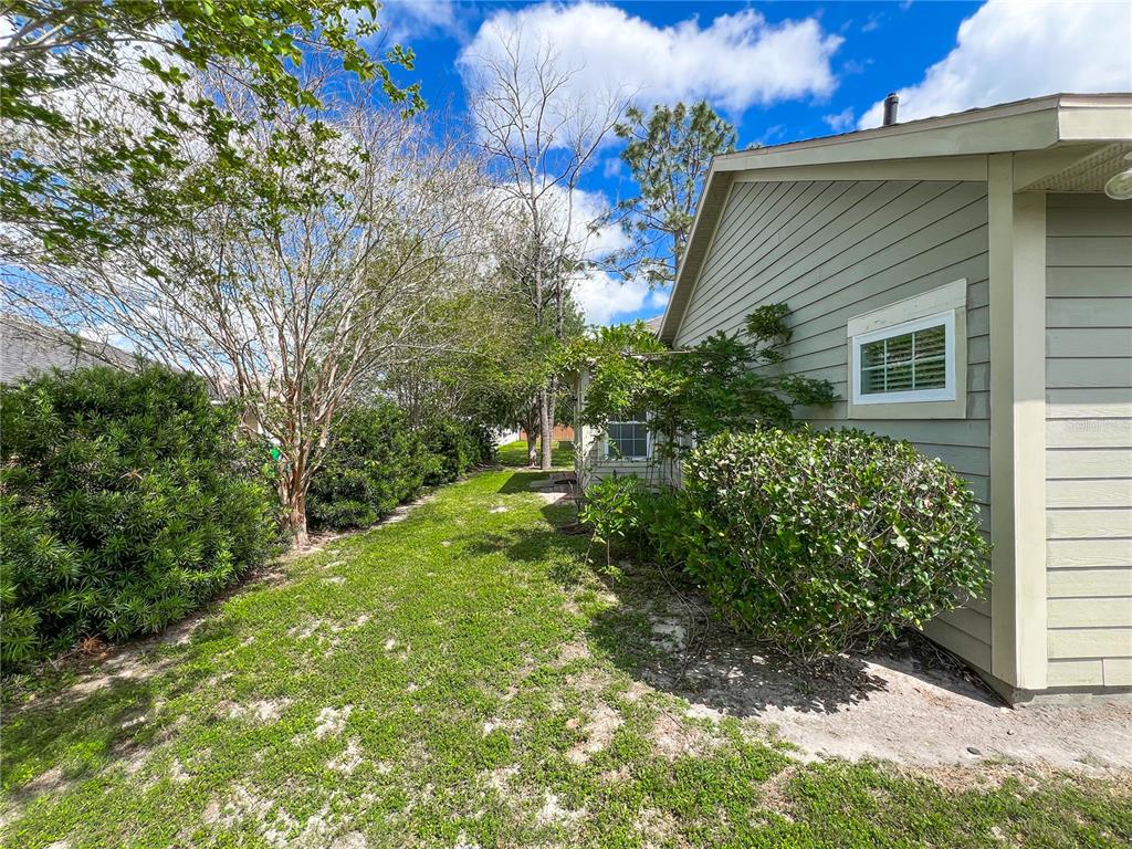 19176 Northwest 228th Street High Springs, FL 32643 - Photo 53 of 68 a backyard of a house with lots of green space