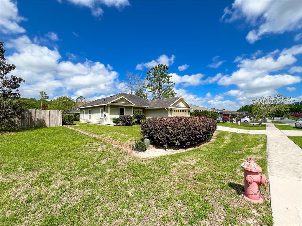 19176 Northwest 228th Street High Springs, FL 32643 - Photo 59 of 68 a view of a house with a backyard