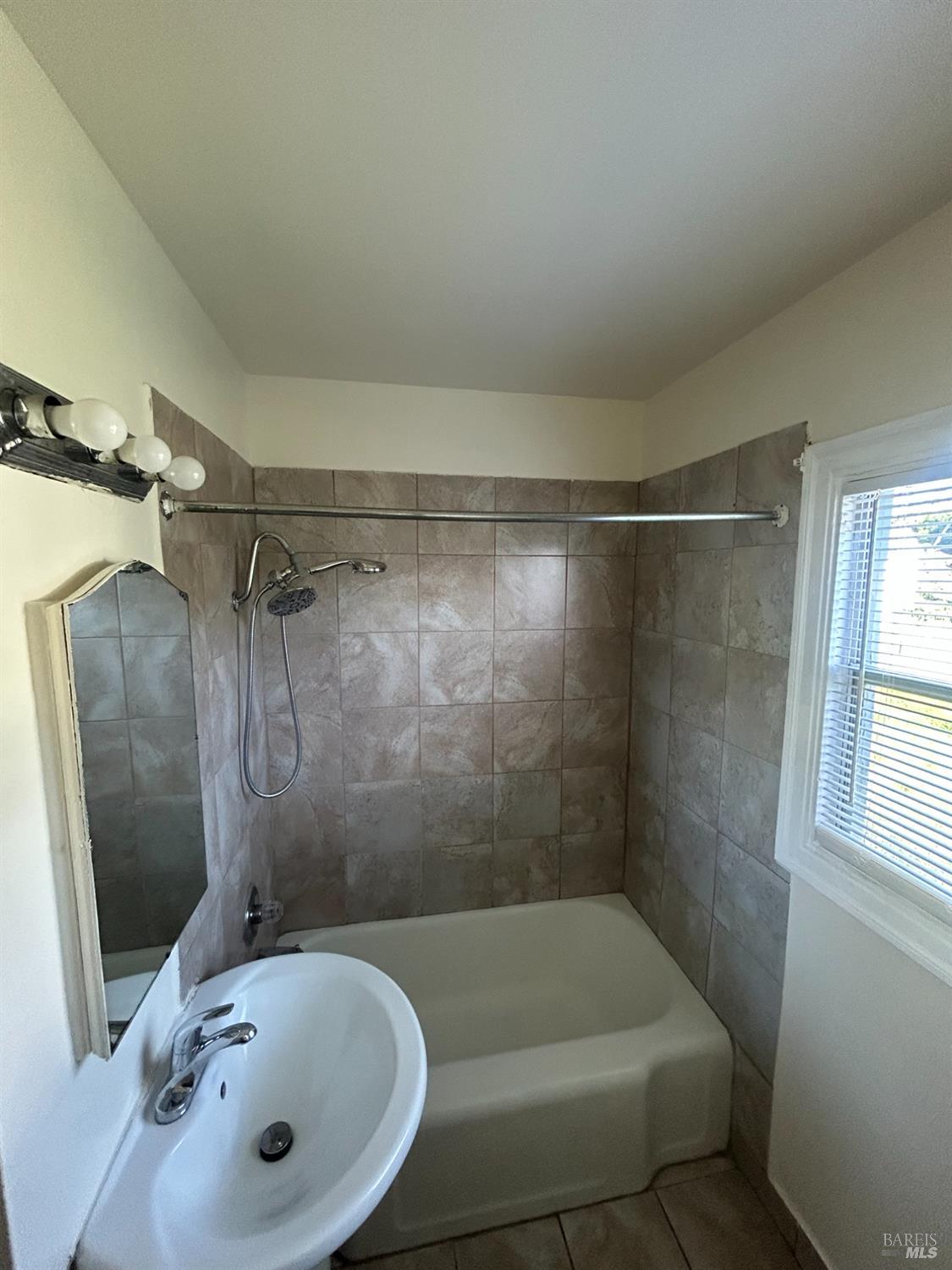 900 Mare Island Way, Unit 916 Vallejo, CA 94590 - Photo 7 of 9 a bathroom with a tub and shower