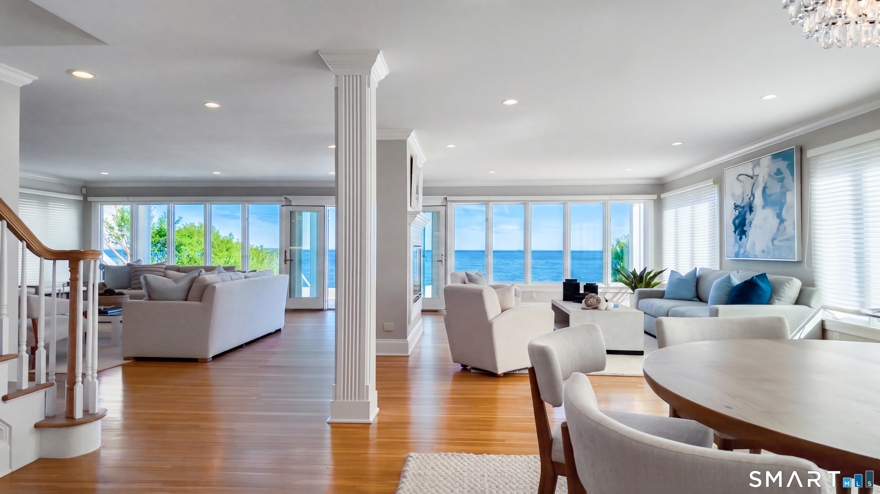 1149 Fairfield Beach Road Fairfield, CT 06824 - Photo 36 of 40 WIDE OPEN floor plan provides gorgeous 180 like degree views add day.....Dining room shown to the right w/ round table, however fits a larger farm table w/ seating for 10-12 easily (ask to see photo)