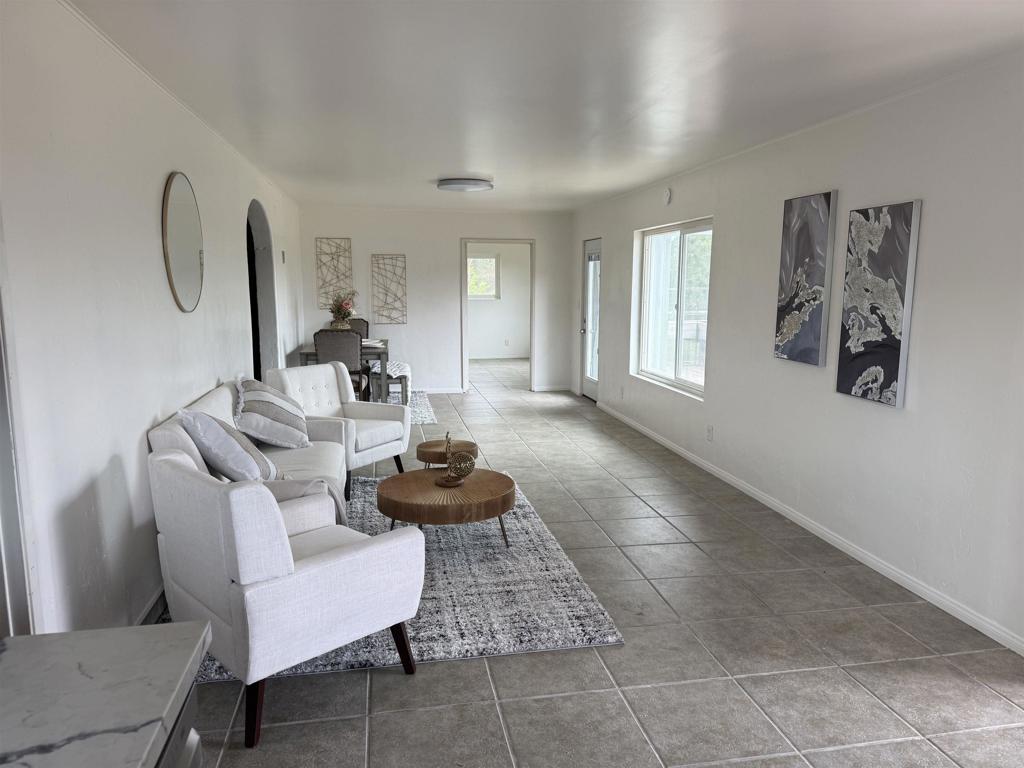 435 Rancho Camino Fallbrook, CA 92028 - Photo 28 of 42 a living room with furniture and a potted plant